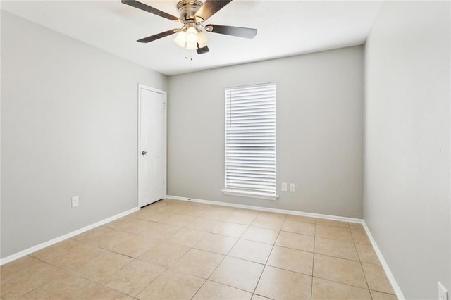 303 Parkview Blvd Unit 303, Mandeville, LA 70471 - empty room with a ceiling fan, light tile patterned flooring, and baseboards