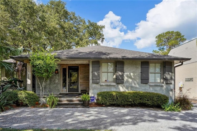 1141 Allen Toussaint Blvd, New Orleans, LA 70124 - view of front of home featuring stucco siding and a shingled roof