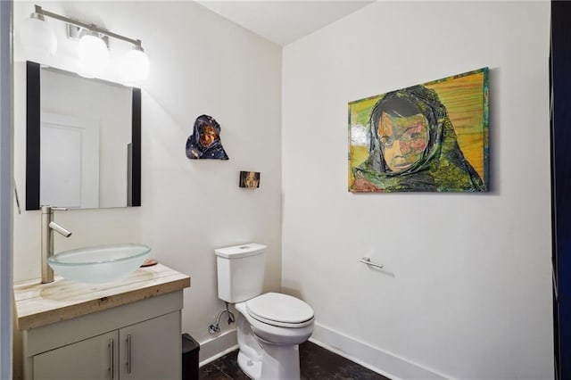 1141 Allen Toussaint Blvd, New Orleans, LA 70124 - bathroom with baseboards, vanity, and toilet