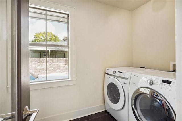 1141 Allen Toussaint Blvd, New Orleans, LA 70124 - laundry room with independent washer and dryer, baseboards, and dark tile patterned floors