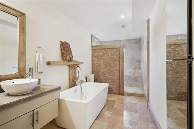 1141 Allen Toussaint Blvd, New Orleans, LA 70124 - full bathroom featuring vanity, a freestanding tub, walk in shower, and recessed lighting