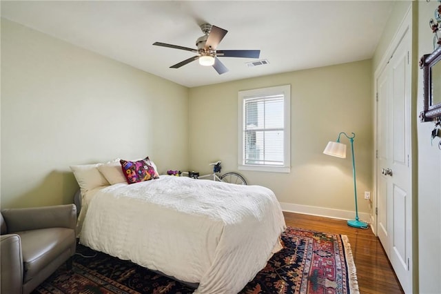 1141 Allen Toussaint Blvd, New Orleans, LA 70124 - bedroom with baseboards, dark wood-style floors, and ceiling fan