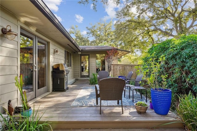 1141 Allen Toussaint Blvd, New Orleans, LA 70124 - wooden deck with grilling area and outdoor dining space