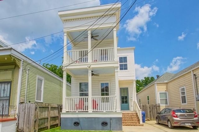 433 S Cortez St, New Orleans, LA 70119 - view of front facade featuring a balcony, a ceiling fan, and covered porch