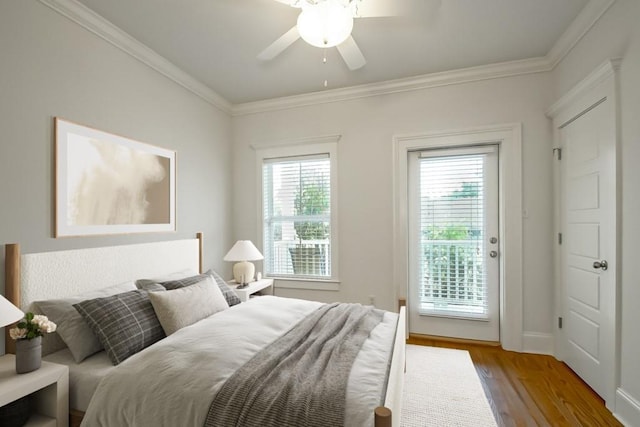 433 S Cortez St, New Orleans, LA 70119 - bedroom featuring multiple windows, wood finished floors, access to outside, crown molding, and ceiling fan
