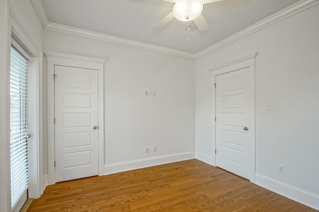433 S Cortez St, New Orleans, LA 70119 - spare room with a ceiling fan, light wood-style flooring, ornamental molding, and baseboards