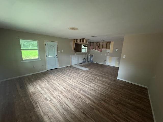 10836 Big Sur Dr, Baton Rouge, LA 70818 - unfurnished living room with dark wood-type flooring and baseboards