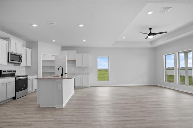 5357 Bypass Breeze Ave, Slidell, LA 70461 - kitchen with stainless steel appliances, a sink, healthy amount of natural light, light wood finished floors, and recessed lighting