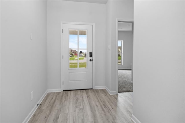 5357 Bypass Breeze Ave, Slidell, LA 70461 - doorway to outside featuring light wood-style floors and baseboards