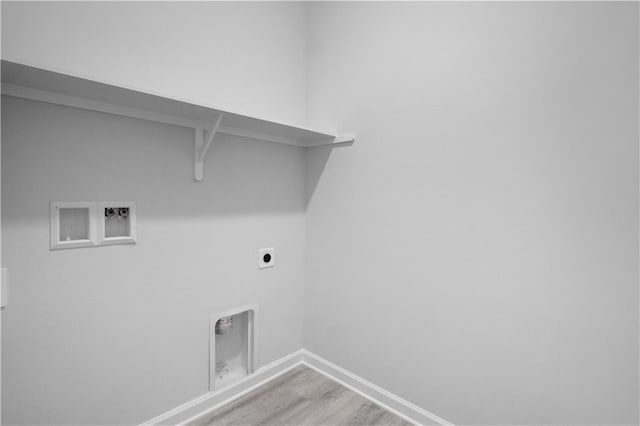 5357 Bypass Breeze Ave, Slidell, LA 70461 - laundry room with electric dryer hookup, washer hookup, baseboards, and light wood finished floors
