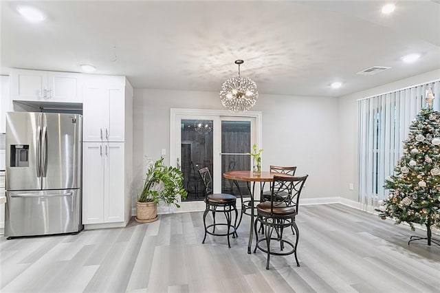 1713 Thomas St, Gretna, LA 70053 - dining room featuring light wood-type flooring, recessed lighting, and a chandelier