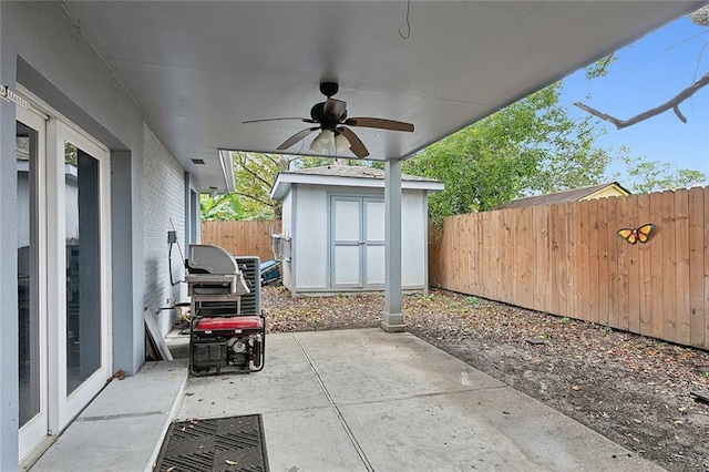 1713 Thomas St, Gretna, LA 70053 - fenced backyard featuring ceiling fan, a patio, a shed, and a grill