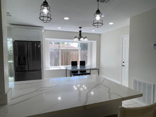 2120 Killington Dr, Harvey, LA 70058 - dining area featuring a textured ceiling, a chandelier, and recessed lighting