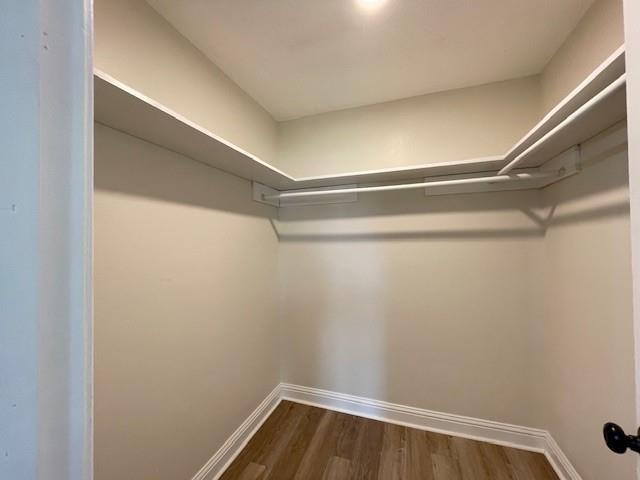 2120 Killington Dr, Harvey, LA 70058 - spacious closet with dark wood-style flooring