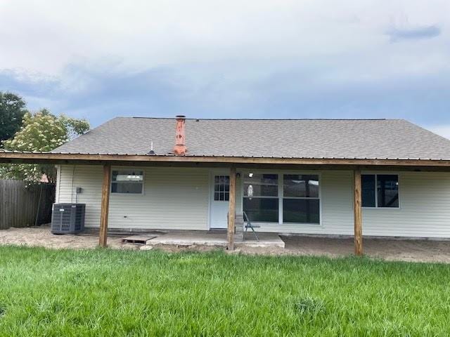 2120 Killington Dr, Harvey, LA 70058 - rear view of property with a patio area, central AC unit, and roof with shingles