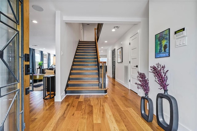 231 Audubon Blvd, New Orleans, LA 70125 - stairway featuring wood finished floors, recessed lighting, and baseboards