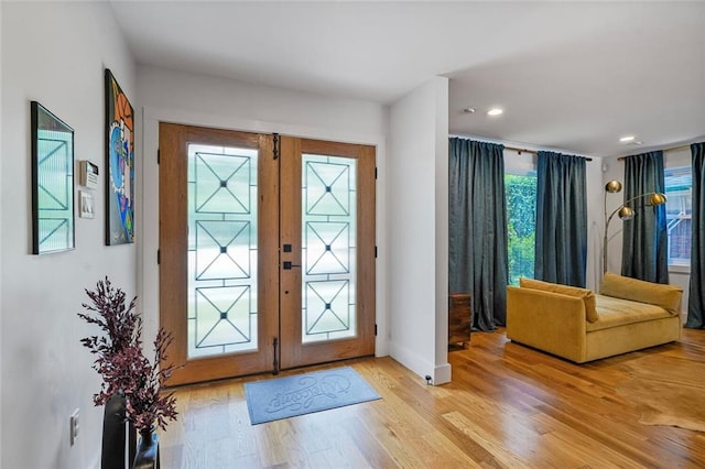 231 Audubon Blvd, New Orleans, LA 70125 - entrance foyer with light wood-style floors, french doors, baseboards, and recessed lighting