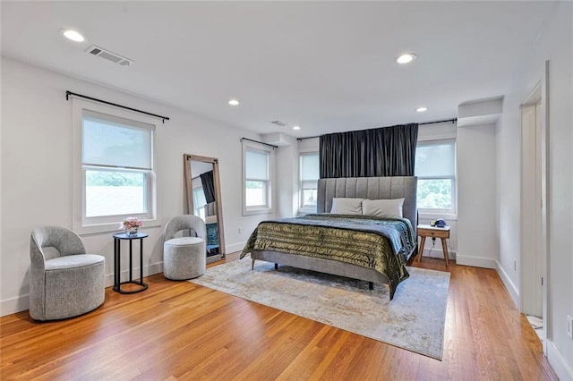 231 Audubon Blvd, New Orleans, LA 70125 - bedroom featuring multiple windows, wood finished floors, baseboards, and recessed lighting
