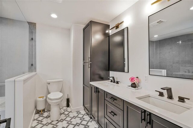 231 Audubon Blvd, New Orleans, LA 70125 - bathroom featuring double vanity, recessed lighting, and a shower