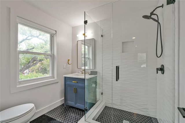 231 Audubon Blvd, New Orleans, LA 70125 - bathroom featuring toilet, a stall shower, vanity, and healthy amount of natural light