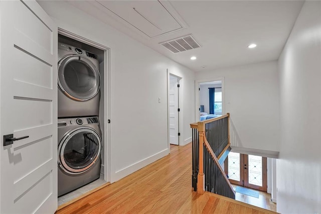 231 Audubon Blvd, New Orleans, LA 70125 - laundry area with stacked washer / dryer, attic access, light wood-type flooring, baseboards, and recessed lighting