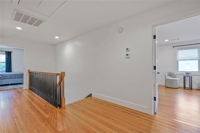 231 Audubon Blvd, New Orleans, LA 70125 - corridor featuring an upstairs landing, light wood-style floors, plenty of natural light, recessed lighting, and baseboards