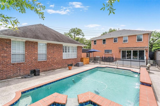 231 Audubon Blvd, New Orleans, LA 70125 - view of swimming pool featuring a patio and a pool with connected hot tub