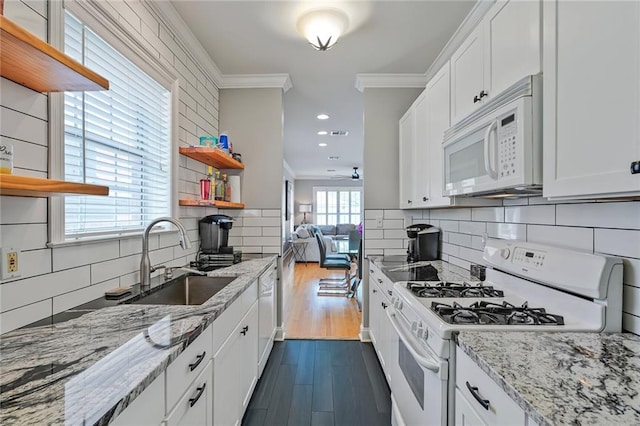 231 Audubon Blvd, New Orleans, LA 70125 - kitchen with white appliances, crown molding, tasteful backsplash, dark wood-style floors, and white cabinetry