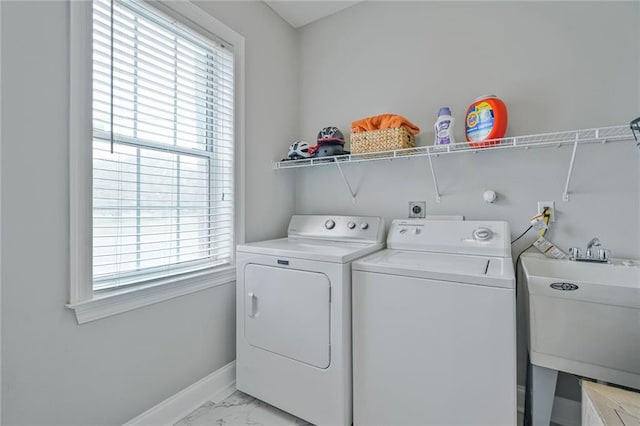 231 Audubon Blvd, New Orleans, LA 70125 - washroom with light marble finish flooring, plenty of natural light, and washer and dryer
