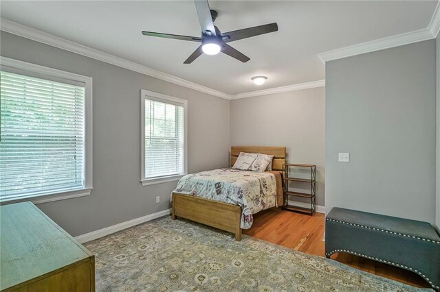 231 Audubon Blvd, New Orleans, LA 70125 - bedroom featuring crown molding, wood finished floors, and a ceiling fan