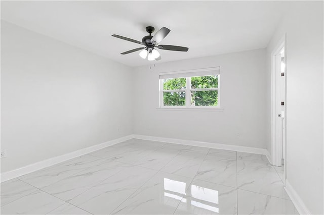 30 Normandy Dr, Kenner, LA 70065 - spare room with light marble finish flooring, baseboards, and ceiling fan