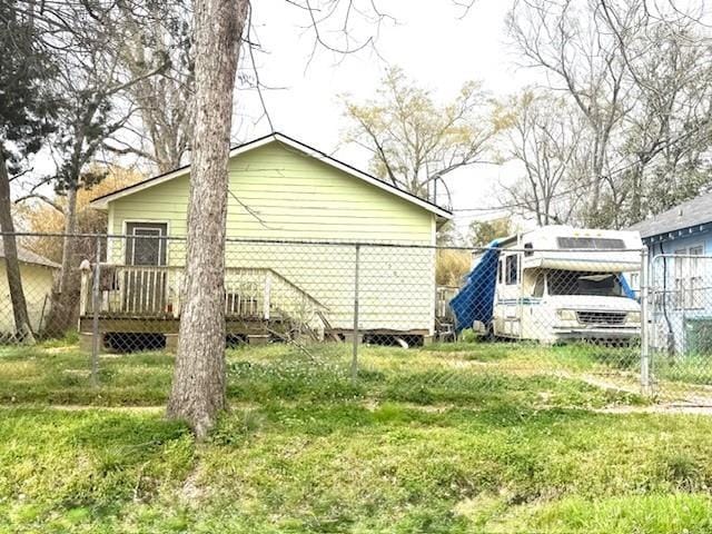 506 S Olive St, Hammond, LA 70403 - view of side of property with a wooden deck