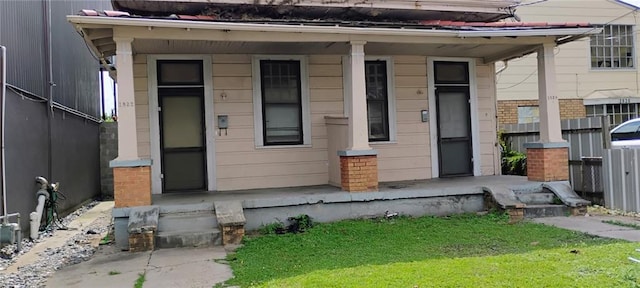 182224 Frenchmen St, New Orleans, LA 70116 - view of front facade with a porch and brick siding
