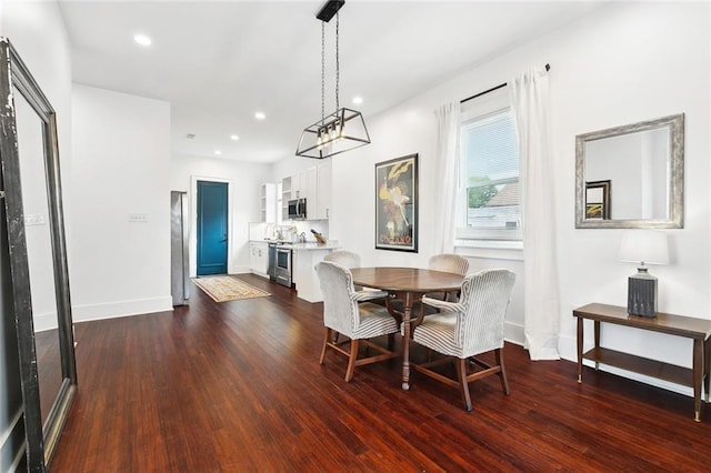 3429 Willow St, New Orleans, LA 70115 - dining area featuring dark wood finished floors, baseboards, a chandelier, and recessed lighting