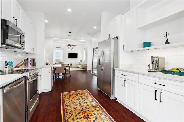 3429 Willow St, New Orleans, LA 70115 - kitchen featuring stainless steel appliances, a ceiling fan, open floor plan, decorative backsplash, and recessed lighting
