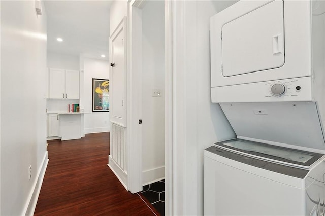 3429 Willow St, New Orleans, LA 70115 - washroom with stacked washing machine and dryer, dark wood finished floors, baseboards, and recessed lighting