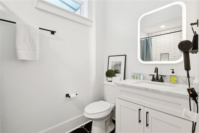 3429 Willow St, New Orleans, LA 70115 - full bathroom with vanity, toilet, curtained shower, baseboards, and tile patterned floors