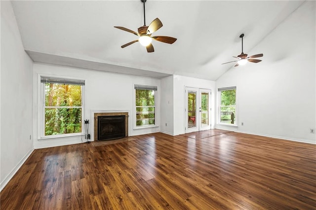 42 E Chamale Cv Unit 42, Slidell, LA 70460 - unfurnished living room featuring a ceiling fan, french doors, wood finished floors, a fireplace with flush hearth, and high vaulted ceiling