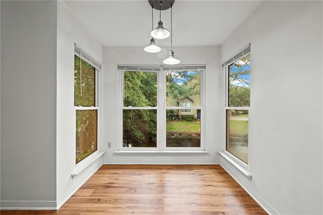 42 E Chamale Cv Unit 42, Slidell, LA 70460 - unfurnished sunroom featuring wood finished floors and baseboards