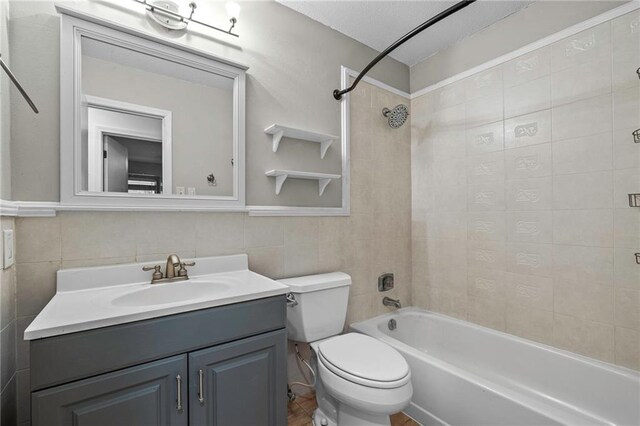 42 E Chamale Cv Unit 42, Slidell, LA 70460 - bathroom featuring tile walls, toilet, vanity, and shower / bath combination