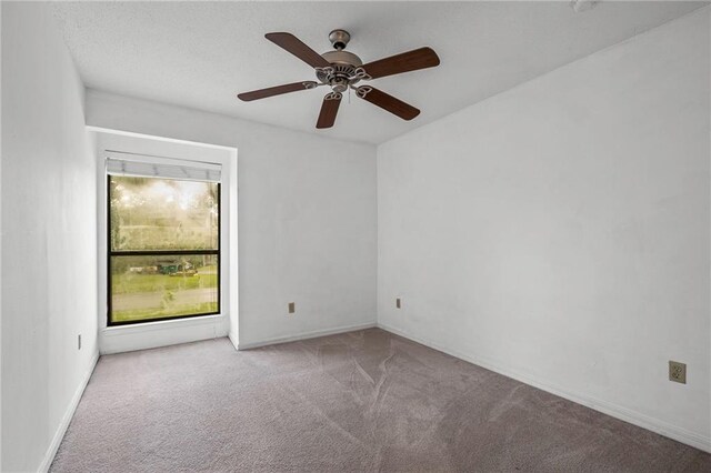 42 E Chamale Cv Unit 42, Slidell, LA 70460 - spare room with carpet, ceiling fan, and baseboards
