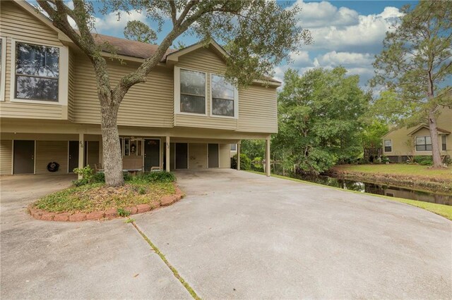 42 E Chamale Cv Unit 42, Slidell, LA 70460 - townhome / multi-family property featuring concrete driveway and a carport