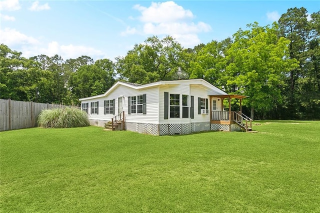 12175 Reid Rd, Amite, LA 70422 - back of house featuring view of wooded area