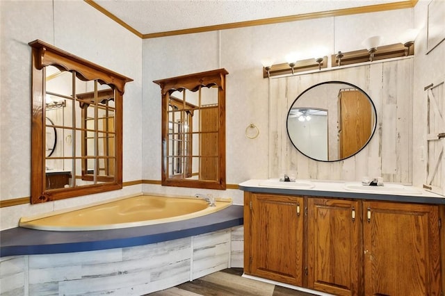 12175 Reid Rd, Amite, LA 70422 - bathroom with crown molding, double vanity, wood finished floors, and a garden tub