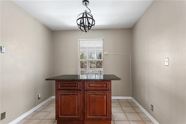 59314 Cypress Bayou Ln, Lacombe, LA 70445 - bar area with light tile patterned flooring, baseboards, and a chandelier