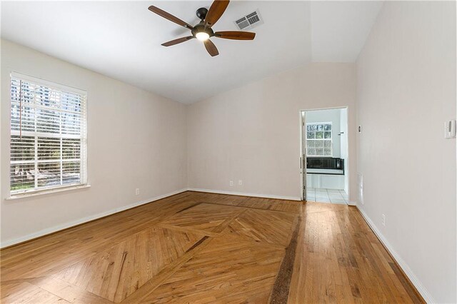 59314 Cypress Bayou Ln, Lacombe, LA 70445 - spare room featuring ceiling fan, lofted ceiling, and baseboards