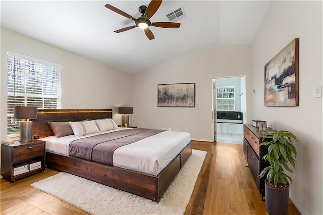 59314 Cypress Bayou Ln, Lacombe, LA 70445 - bedroom with light wood-style floors, lofted ceiling, a ceiling fan, and baseboards