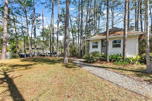 59314 Cypress Bayou Ln, Lacombe, LA 70445 - view of grassy yard featuring driveway