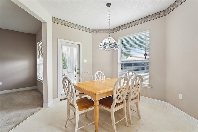 1124 Indigo Ct, Slidell, LA 70460 - dining room featuring healthy amount of natural light, baseboards, and a textured ceiling