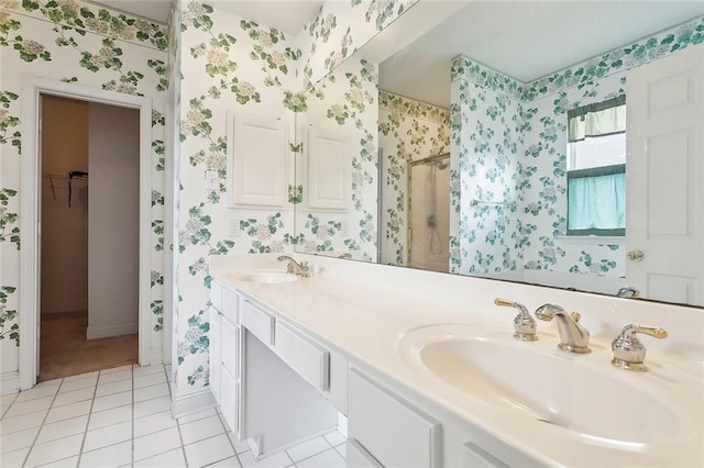 1124 Indigo Ct, Slidell, LA 70460 - full bathroom featuring wallpapered walls, a stall shower, double vanity, tile patterned flooring, and a spacious closet